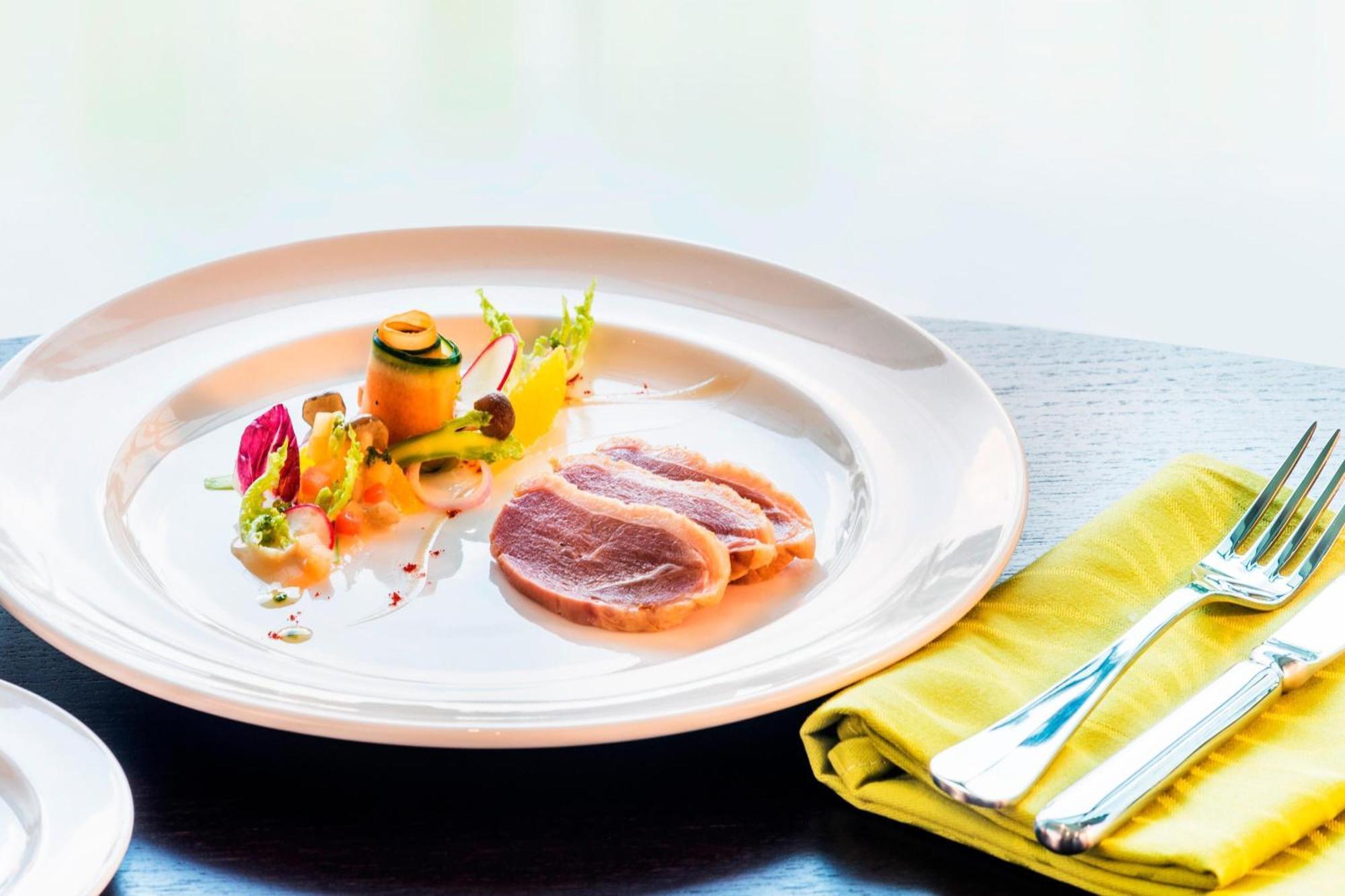 Le Meridien Putrajaya Dış mekan fotoğraf A plate of duck confit